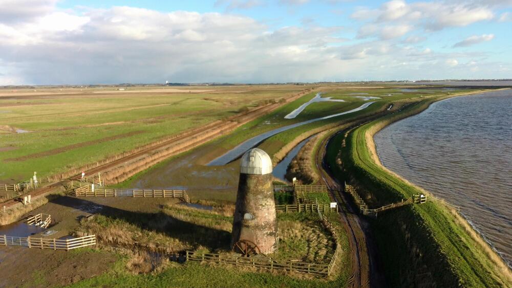 Loughlins Marsh Completed Dec 2023, redundant old wind pump in forwground