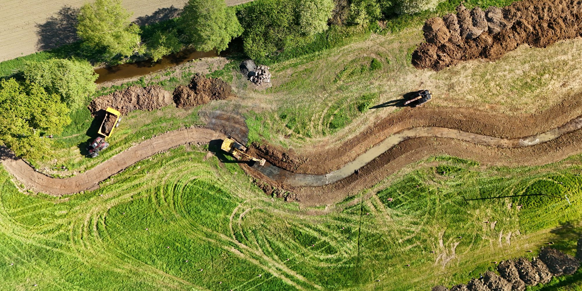 Panoramic Aerial view of construction of meanders at Starston Beck, showing Excavators and dumpers at work in April 2025