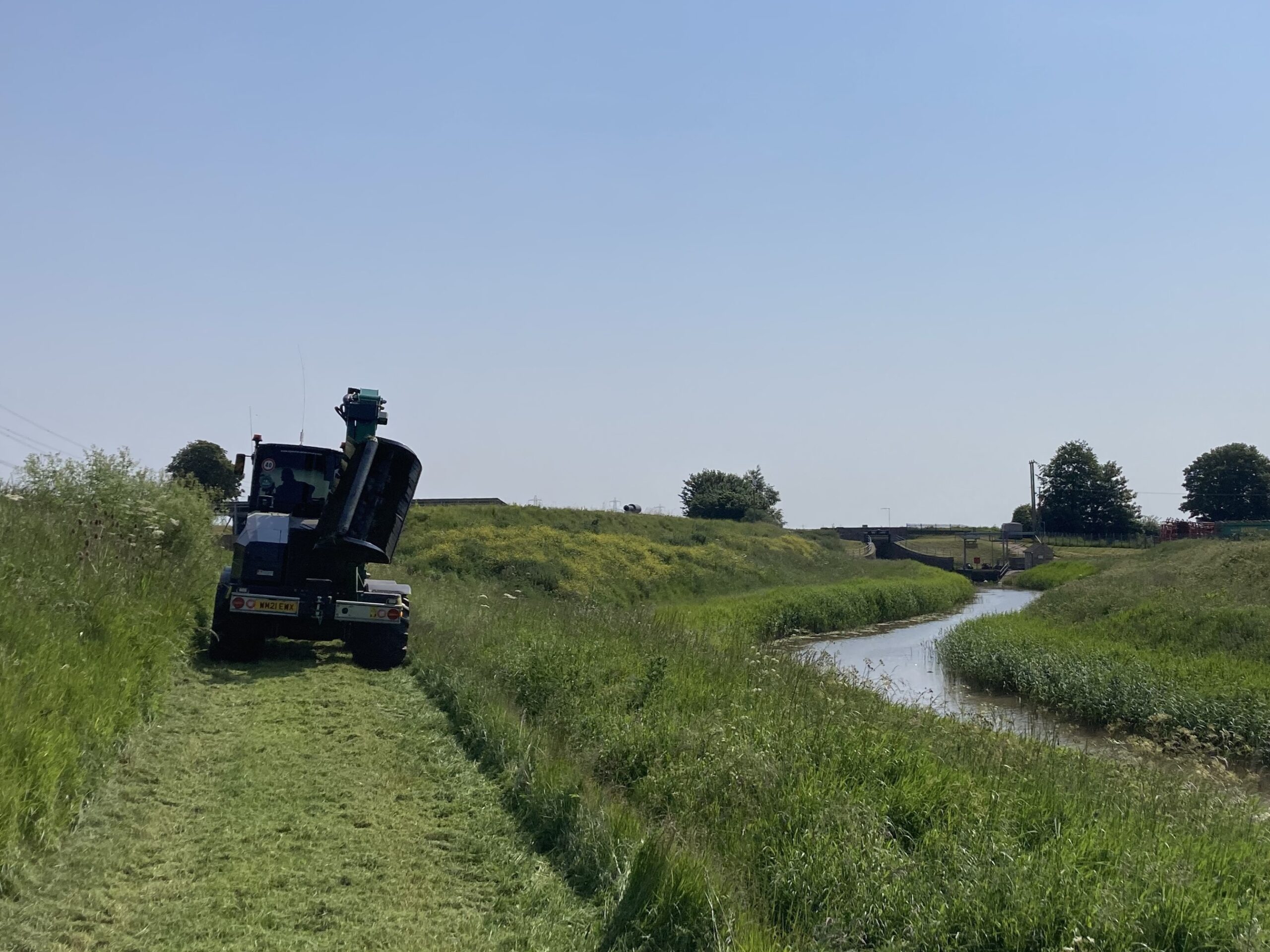 Kings Lynn IDB grass cutting on the Mill Basin bank to maintain acces to the public Footpath