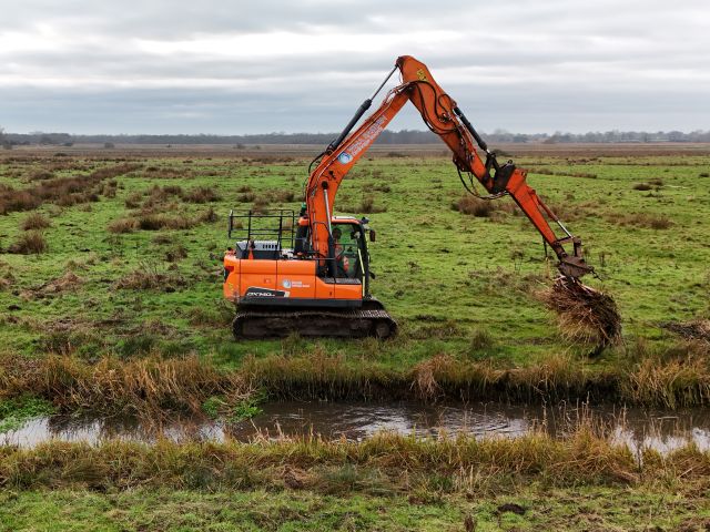 Excavator carrying out watercourse maintenance as part of the Grasswrack Pondweed rescue October 2024
